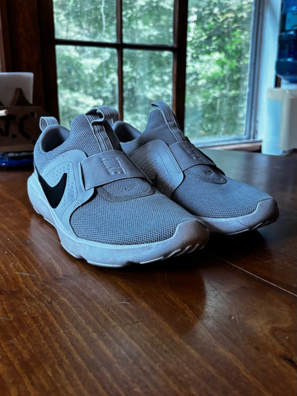 Nike Light Gray/White Slip-On Sneakers with Black Swoosh